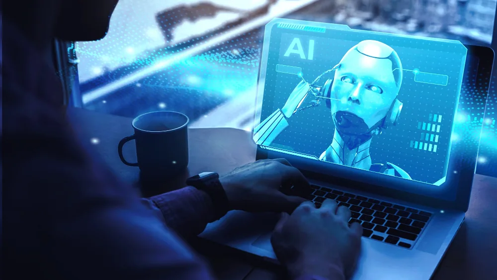 Developer building an AI application on a laptop with an AI assistant on screen