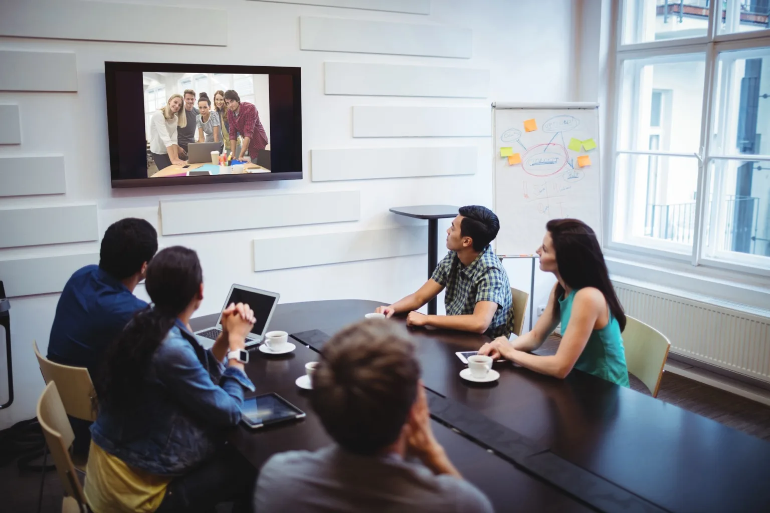 Product team on a video call reviewing a build